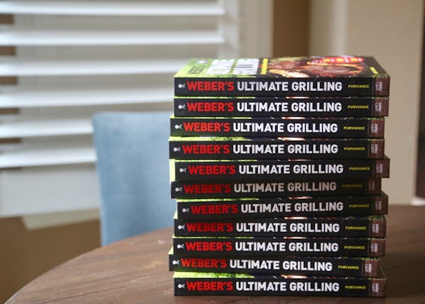 Stack of Weber Ultimate Grilling Cookbook