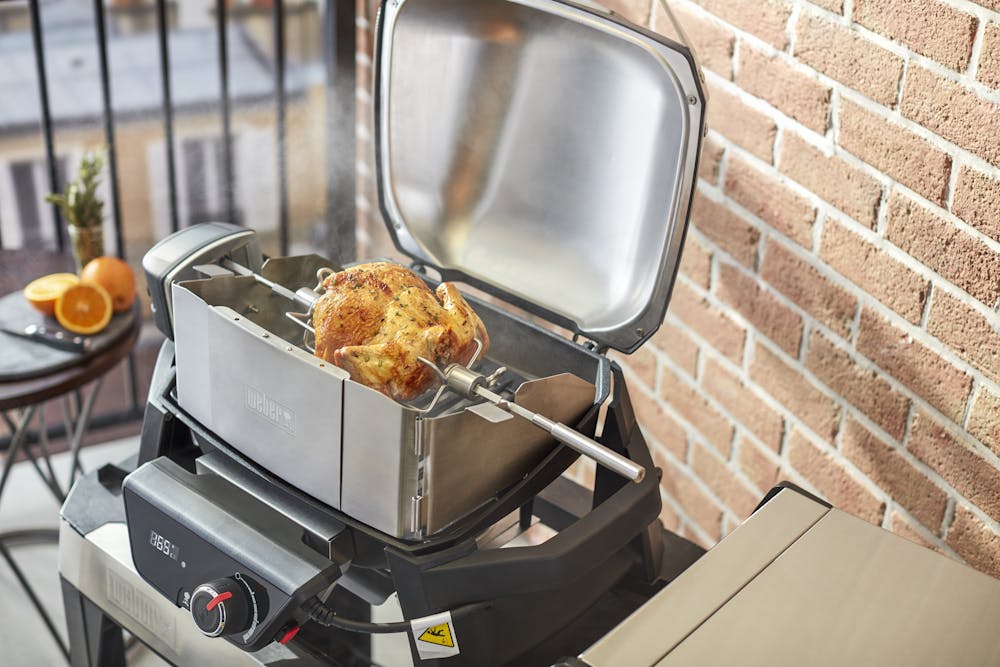 Asador de carne y pollos para una barbacoa giratoria