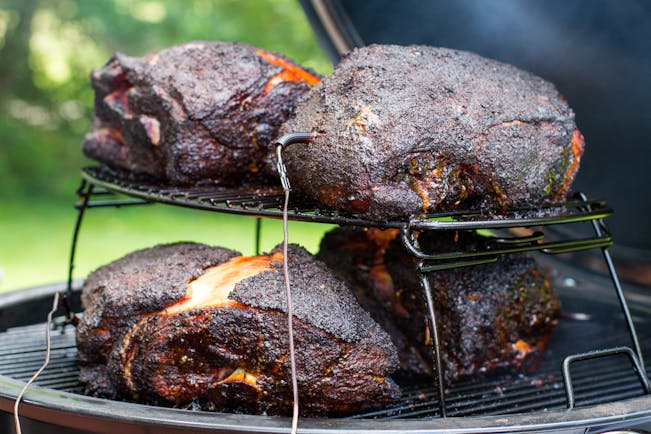 https://content-images.weber.com/content/blog/Grilling-Inspiration/Pork-Shoulder-Summit-Charcoal-1.jpg?auto=compress,format&w=742&h=434