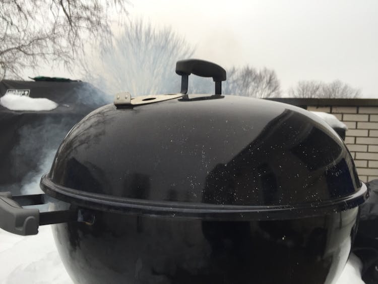 https://content-images.weber.com/content/blog/hero-images/5644a338c2640_2015-11-week-3-thanksgiving-kolman-Smoking-or-Roasting-Your-Turkey-on-a-Cold-Day-PHOTO-kettle-in-the-winter-copy.jpg?auto=compress,format&w=750