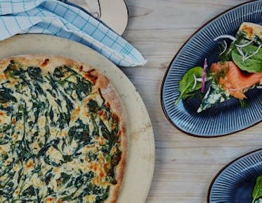 Pizza with smoked salmon and creamed spinach