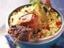 Spiedini Di Agnello In Crosta Di Pepe Con Tomatillos E Melanzane