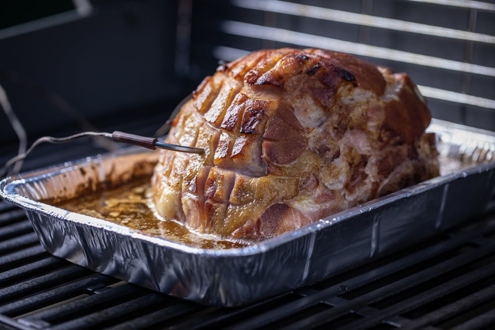 https://content-images.weber.com/gallery/blog/2018-12-Holidays-Lang-How-to-Grill-a-Ham-with-a-Fan-Favorite-Recipe-BLOG-PHOTO-iGrill-Ham-Gensis-II-12.jpg?auto=compress,format&w=1000&fit=clip